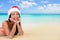 Santa hat Christmas Asian woman on tropical beach
