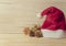 Santa hat and golden pine cones glittered christmas and gift box