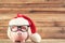Santa hat with piggybank and eyeglasses