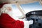 Santa Holding Control Wheel In Cockpit Of Private