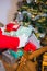 Santa keeping gifts on wooden trolley