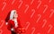 Santa kid with present box. Little child celebrating Christmas. New year advertising. Copy space.