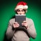 Santa man is shocked while reading on tablet