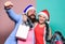 Santa man and woman with tinsel. christmas shopping sales. winter holidays celebrate together. happy new year party