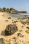 SANTA MARIA, CABO VERDE - DECEMBER 02, 2017: sandy beach with stones next to the pier in Santa Maria