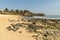 SANTA MARIA, CABO VERDE - DECEMBER 02, 2017: sandy beach with stones next to the pier in Santa Maria