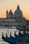 Santa Maria della Salute and gondola parking at sunset in Venice