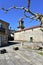 Santa Maria Magdalena medieval church, side view with baroque tower and tree. Ribadavia, Spain.