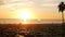 SANTA MONICA, LOS ANGELES, USA - 28 OCT 2019: California summertime beach aesthetic, atmospheric golden sunset. Unrecognizable