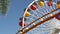 SANTA MONICA, LOS ANGELES, USA - 28 OCT 2019: Iconic colorful retro ferris wheel, roller coaster in amusement park. Famous classic