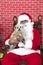 Santa Paws with white puppy dog