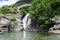 Santa Petronilla waterfalls with roman bridge in Biasca