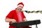 Santa plays and sings on electric piano