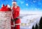 Santa removing gift sack from chimney