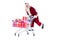 Santa rides on a shopping cart