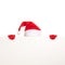 Santa\'s cap and hands in red gloves hold blank