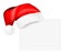 Santa\'s cap hanging on a blank card