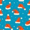 Santa`s hats vector seamless pattern