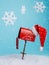 Santa`s mailbox with snowflakes falling isolated on a bright blue background. Creative Xmas and New Year celebration concept.