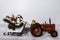 Santa`s sleigh being pulled by a red tractor