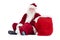 Santa sits next to his bag