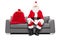 Santa sitting on a sofa with bag of presents