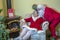 Santa sneaking to Mrs. with mistletoe