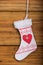 Santa sock hang on wood background