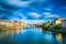 Santa Trinita and Old Bridge on Arno river, sunset landscape. Florence or Firenze, Italy.