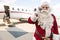 Santa Using Mobile Phone Against Private Jet