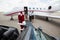 Santa walking up to private jet