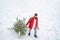 Santa in winter park. Lumberjack Santa standing with axe on forest background. Santa Lumberjack fir tree in the white