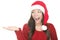 Santa woman showing copyspace excited