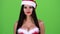 Santa woman starts smiles. Green screen. Close up