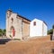 Santarem, Portugal. Facade with gothic portal and bell tower or belfry of the Igreja de Santa Cruz