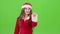 Santas assistant draws an airy congratulation on the new year. Green screen. Slow motion