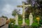 SANTIAGO, CHILE - OCTOBER 16, 2018: Outdoor view of stoned cross with a Jesus, sith stow stoned sculptures next to the