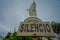 SANTIAGO, CHILE - OCTOBER 16, 2018: Unidentified people walking close to the statue of the Virgin Mary on the top of the