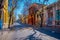 SANTIAGO, CHILE - SEPTEMBER 13, 2018: Cars circulating in a stoned pavement under trees at one side of the street in the