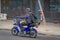 SANTIAGO, CHILE - SEPTEMBER 13, 2018: Unidentified man riding his blue motorcycle in the streets of dowtown in the city