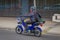 SANTIAGO, CHILE - SEPTEMBER 13, 2018: Unidentified man riding his blue motorcycle in the streets of dowtown in the city