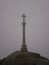 Santiago Cross On A Foggy Day At The End Of The Camino De Santiago In Finisterre. August 7, 2012. Finisterre La Coruna Galicia,