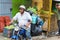 SANTIAGO DE LOS CABALLEROS - JUNE 20, 2019: Man in a motorcycle at farmer market in the city of Santiago