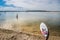 Santiago do Cacém PORTUGAL - 6 August 2019 - Paddle board in the water of Santo André lagoon with people in the water