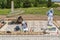 Santiponce Sevilla, Spain, May 4, 2017. Restorers restore the mosaic on the ruins of the ancient roman city of Italica