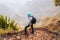 Santo Antao Island, Cape Verde. Traveler with backpack on hiking stony path enjoying view of surreal Xo Xo valley and