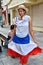 Santo Domingo, Dominican Republic. Girl in traditional Dominican dress. El Conde Street, Colonial Zone.