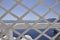 Santorini, 2nd september: Seascape with Santorini caldera through a wooden grille from the picturesque town Fira