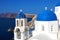 Santorini famous village with white houses and blue domes like blue Mediterranean sea, Greece, Europe