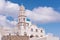 Santorini Greece Church with bells and cross against blue sky